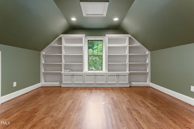 bonus room with baseboards, lofted ceiling, light wood-style flooring, and recessed lighting
