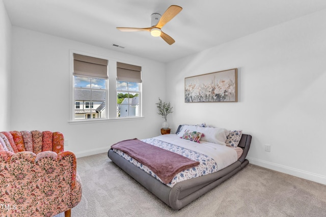 bedroom with carpet flooring, baseboards, and ceiling fan