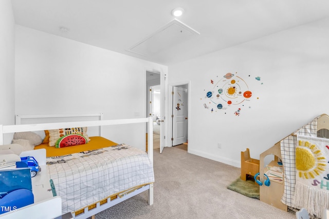 bedroom with attic access, carpet floors, and baseboards