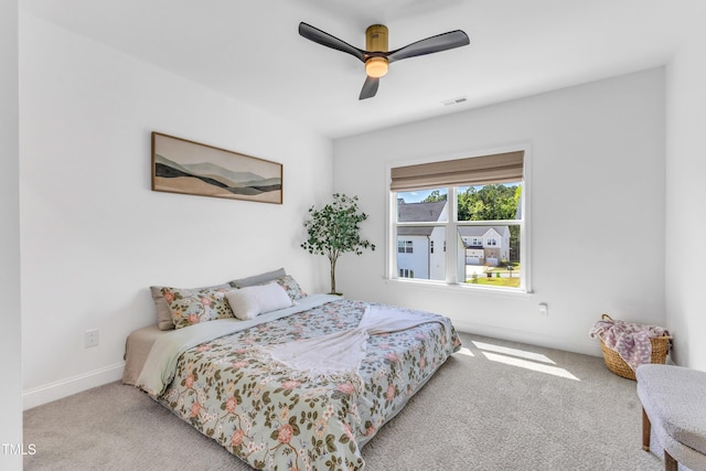bedroom featuring carpet flooring, baseboards, and a ceiling fan