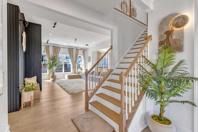 stairway featuring wood-type flooring