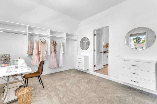 bedroom with carpet flooring, lofted ceiling, and baseboards