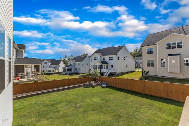 view of yard featuring a residential view