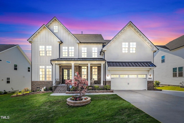 modern inspired farmhouse with board and batten siding, brick siding, and a porch