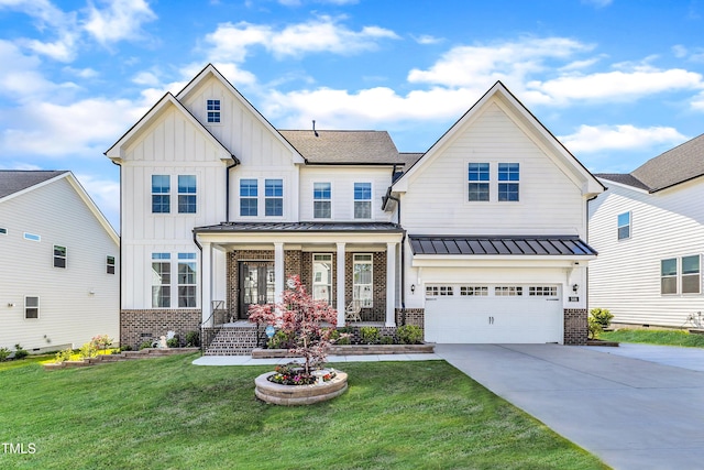 view of front of property with board and batten siding, brick siding, concrete driveway, and a front lawn