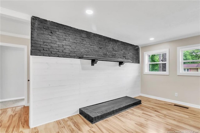 detailed view of wood finished floors, baseboards, and recessed lighting