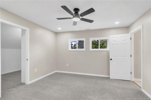 carpeted spare room featuring a ceiling fan, baseboards, and recessed lighting