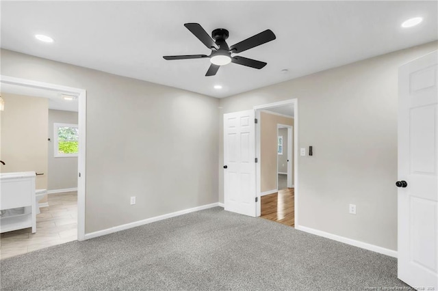 unfurnished bedroom featuring carpet floors, baseboards, recessed lighting, connected bathroom, and a ceiling fan