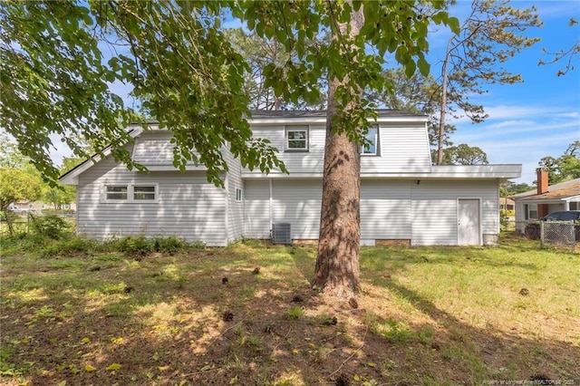 back of property featuring central AC unit