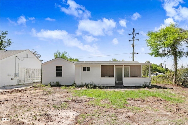 back of house with a sunroom