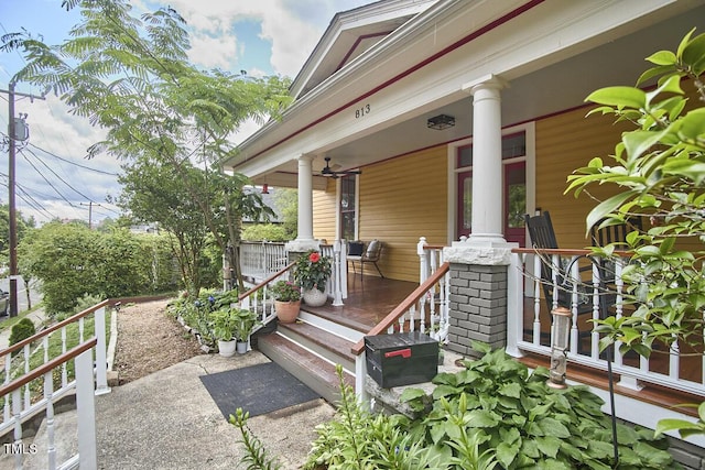 view of exterior entry featuring covered porch