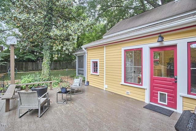 view of patio with fence and a wooden deck