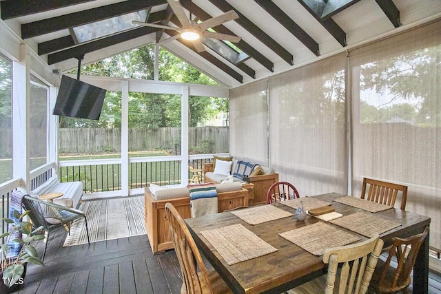 sunroom with a ceiling fan and outdoor dining space