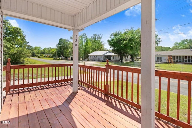 wooden deck with a yard