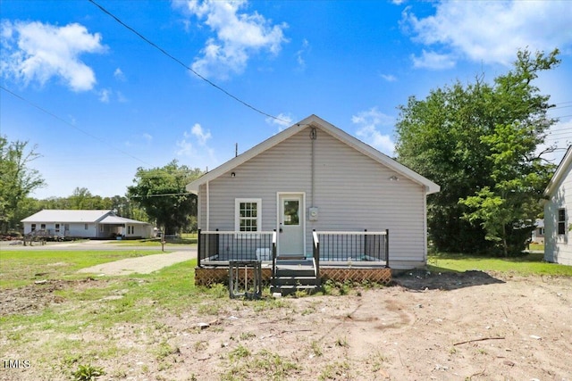 back of property with a deck