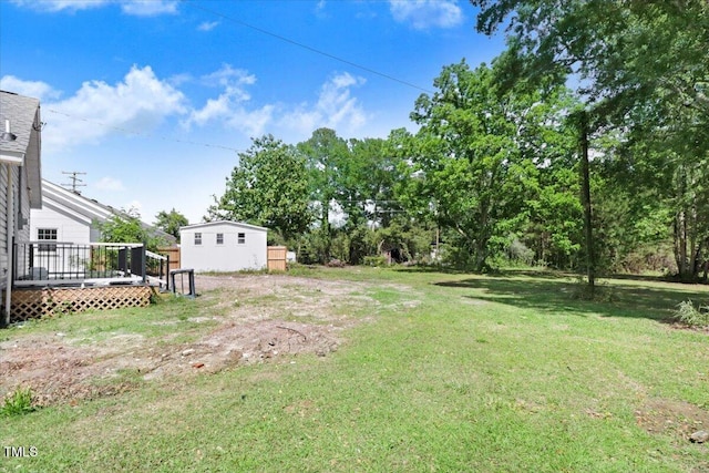 view of yard featuring a wooden deck