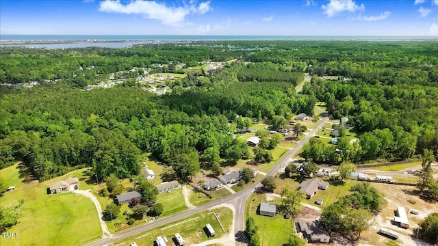 aerial view of property's location with a forest