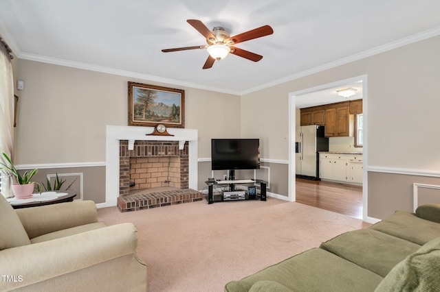 124 Windmere Dr, Angier, NC 27501 - living area featuring ornamental molding, ceiling fan, light carpet, a brick fireplace, and baseboards