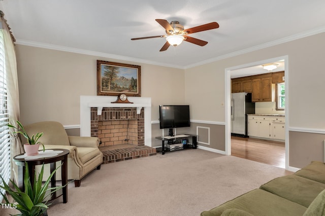124 Windmere Dr, Angier, NC 27501 - living area featuring crown molding, ceiling fan, a fireplace, and light colored carpet
