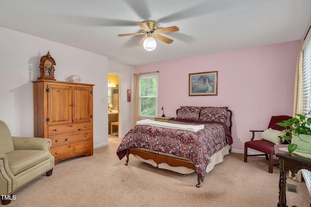 124 Windmere Dr, Angier, NC 27501 - bedroom featuring light colored carpet, ensuite bathroom, ceiling fan, and baseboards