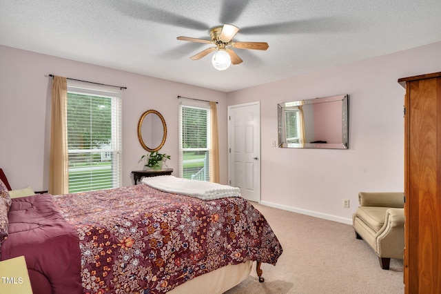 124 Windmere Dr, Angier, NC 27501 - bedroom with light colored carpet, ceiling fan, a textured ceiling, and baseboards