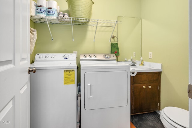 124 Windmere Dr, Angier, NC 27501 - laundry room with separate washer and dryer and wood finished floors