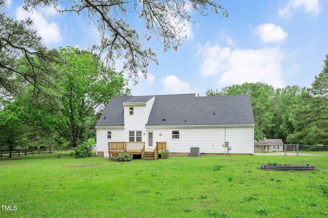 124 Windmere Dr, Angier, NC 27501 - back of house with central AC unit, a deck, and a shingled roof