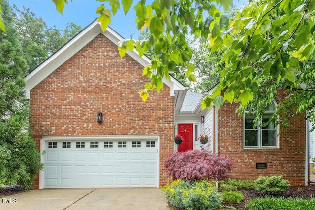 traditional home with concrete driveway and brick siding