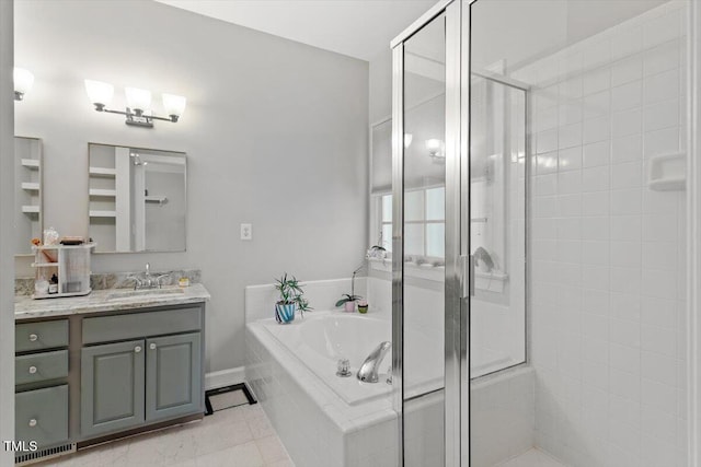 full bath with a shower stall, a garden tub, vanity, and tile patterned floors