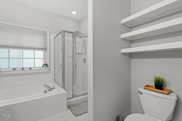 bathroom featuring a stall shower, a bath, toilet, and marble finish floors