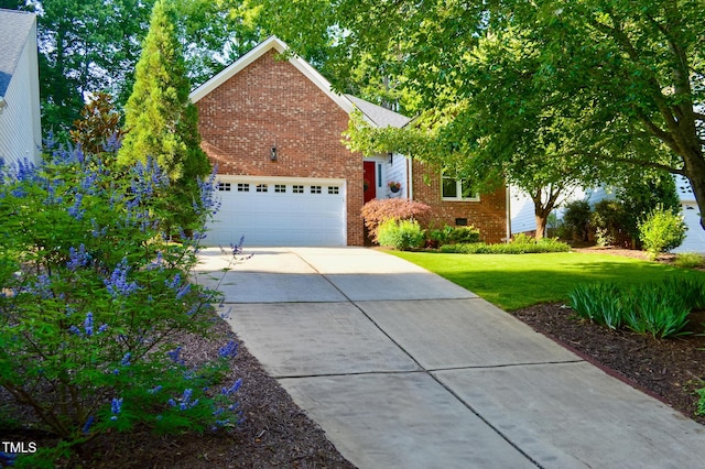 123 Chimney Rise Dr, Cary, NC 27511 - obstructed view of property featuring brick siding, an attached garage, driveway, and a front lawn