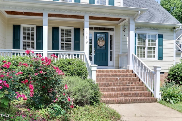 119 Marykirk Pl, Garner, NC 27529 - doorway to property with roof with shingles and covered porch
