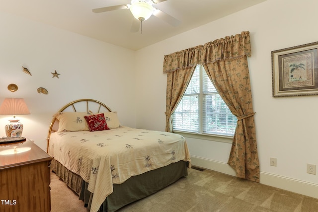 119 Marykirk Pl, Garner, NC 27529 - bedroom with light carpet, ceiling fan, and baseboards
