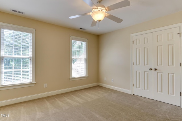 119 Marykirk Pl, Garner, NC 27529 - unfurnished bedroom featuring carpet flooring, baseboards, a closet, and a ceiling fan