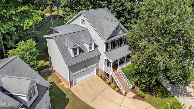 view from above of property with a tree filled landscape