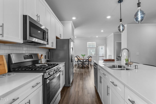 6352 Perry Creek Rd, Raleigh, NC 27616 - kitchen featuring stainless steel appliances, a sink, crown molding, light countertops, and white cabinets