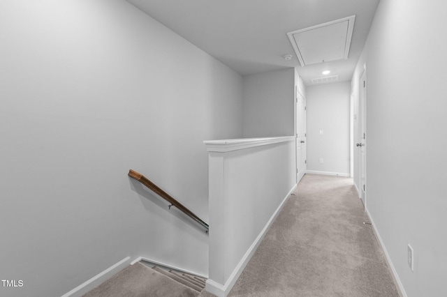 6352 Perry Creek Rd, Raleigh, NC 27616 - hall with an upstairs landing, attic access, carpet floors, and baseboards
