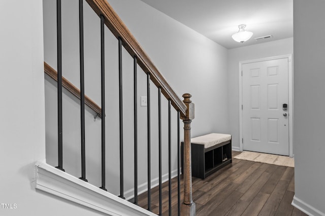 6352 Perry Creek Rd, Raleigh, NC 27616 - entrance foyer featuring dark wood-style flooring, stairs, and baseboards