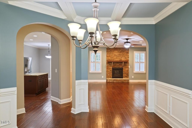 337 Shadowdale Ln, Rolesville, NC 27571 - unfurnished living room featuring ceiling fan, dark wood-style floors, a chandelier, a fireplace, and crown molding