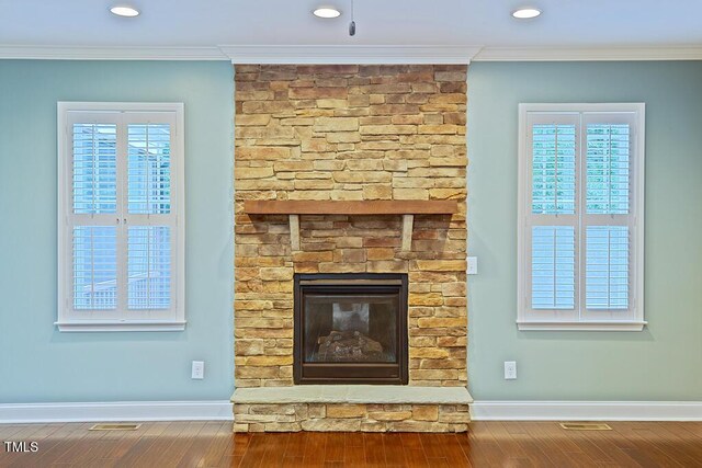 337 Shadowdale Ln, Rolesville, NC 27571 - detailed view of wood finished floors, ornamental molding, baseboards, a fireplace, and recessed lighting
