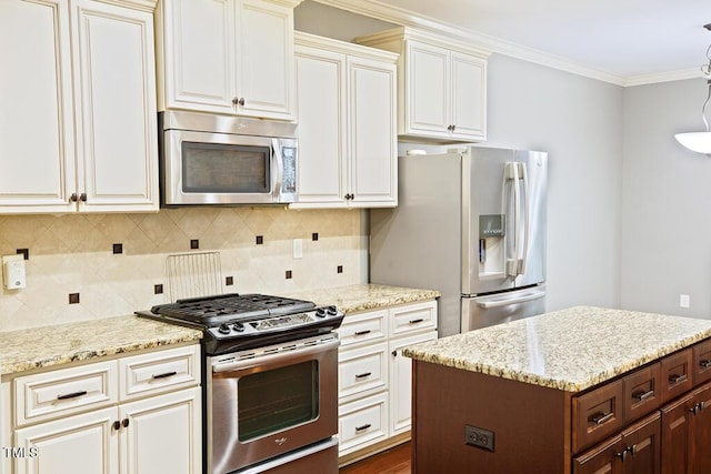 337 Shadowdale Ln, Rolesville, NC 27571 - kitchen with appliances with stainless steel finishes, light stone counters, decorative backsplash, ornamental molding, and a center island