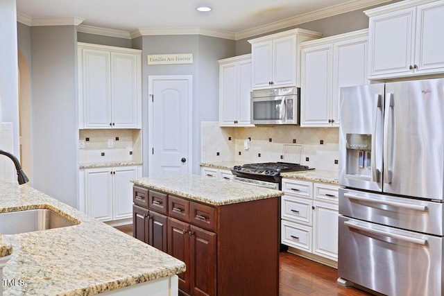 337 Shadowdale Ln, Rolesville, NC 27571 - kitchen with appliances with stainless steel finishes, a sink, dark wood-type flooring, white cabinetry, and recessed lighting
