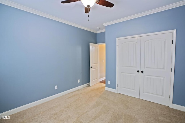337 Shadowdale Ln, Rolesville, NC 27571 - unfurnished bedroom with crown molding, carpet floors, a closet, baseboards, and a ceiling fan