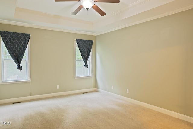 337 Shadowdale Ln, Rolesville, NC 27571 - unfurnished room with a raised ceiling, crown molding, a ceiling fan, light carpet, and baseboards