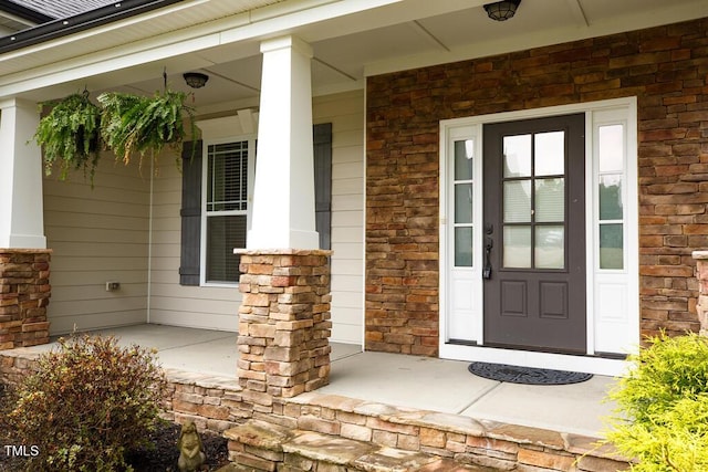 337 Shadowdale Ln, Rolesville, NC 27571 - property entrance featuring a porch, stone siding, and brick siding