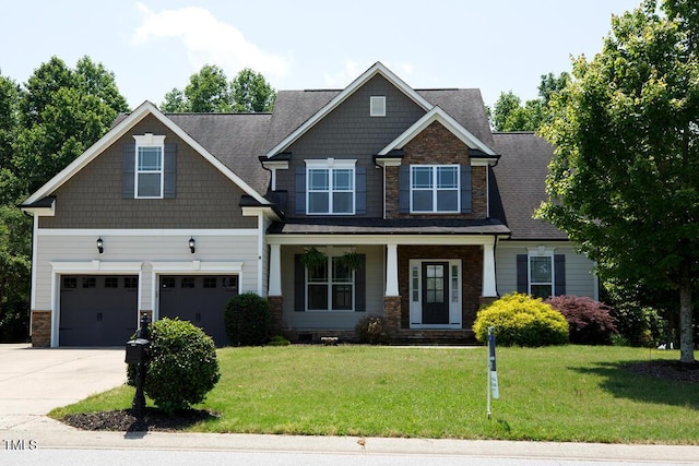 337 Shadowdale Ln, Rolesville, NC 27571 - craftsman inspired home featuring a garage, concrete driveway, stone siding, a front yard, and covered porch