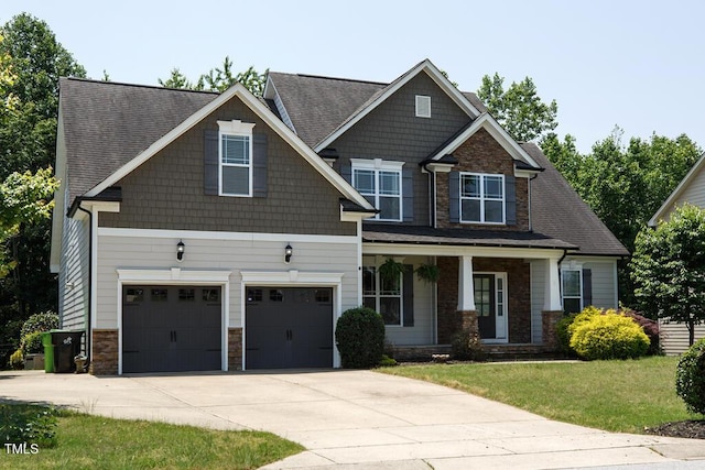 337 Shadowdale Ln, Rolesville, NC 27571 - craftsman inspired home featuring a porch, stone siding, driveway, a front yard, and a garage