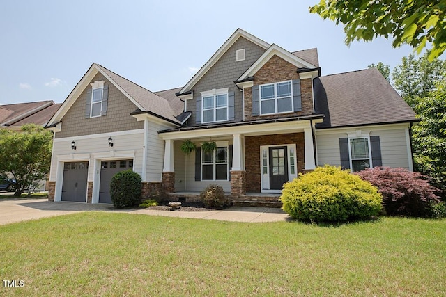337 Shadowdale Ln, Rolesville, NC 27571 - craftsman-style house with stone siding, a garage, concrete driveway, a front lawn, and covered porch