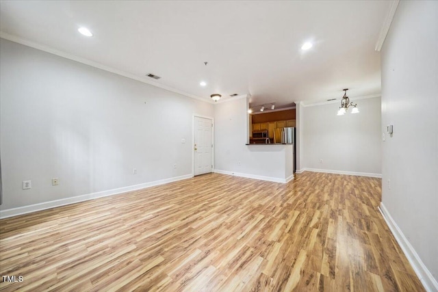 1301 Durlain Dr Unit 103, Raleigh, NC 27614 - unfurnished living room with light wood-type flooring, crown molding, baseboards, recessed lighting, and a chandelier