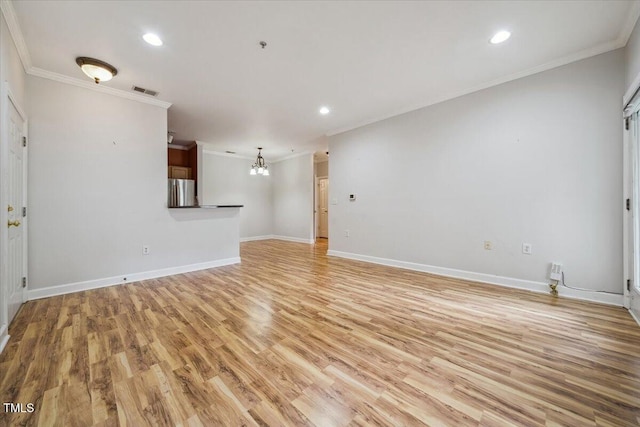1301 Durlain Dr Unit 103, Raleigh, NC 27614 - unfurnished living room with crown molding, light wood-type flooring, recessed lighting, baseboards, and a chandelier